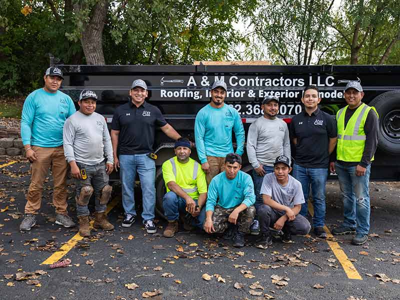 The A&M Contractors LLC crew posing for a picture